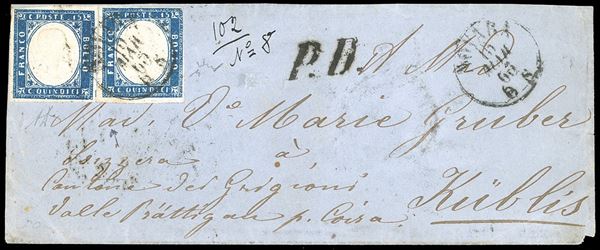1863 - 15 cent. azzurro tipo Sardegna (11), due esemplari, uno perfetto e ben marginato, l'altro giusto a destra, su lettera da Novara 15/3/1863 a Kublis, in Svizzera, numerosi bolli di transito e di arrivo al verso. A.Diena, Chiavarello.