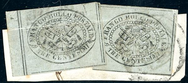 1867 - 3 cent. grigio (15), due esemplari, ottimi margini, usati su frammento di fascetta, lieve piega d'applicazione. Affrancatura multipla di questo francobollo molto rara. Emilio Diena, cert. Ferrario. Ex coll. Imperato.