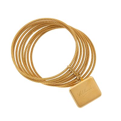 Bracciale rigido in oro giallo 750/1000 con cerchi e medaglia incisa