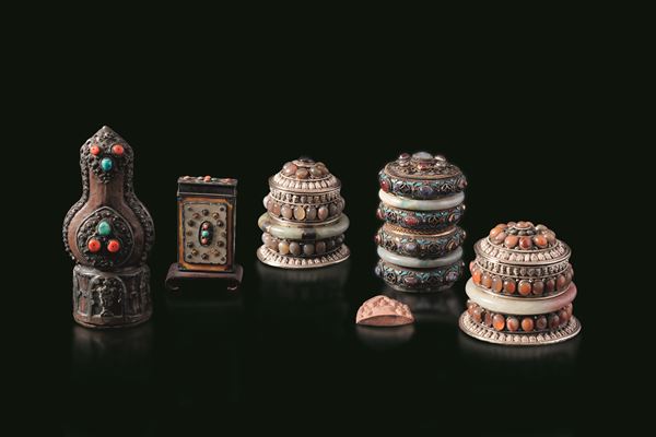 A lot comprising four silver boxes with hardstone inlays and jade ring handles, together with a silver sculpture and a stone Buddha figure, China and India, 19th century.