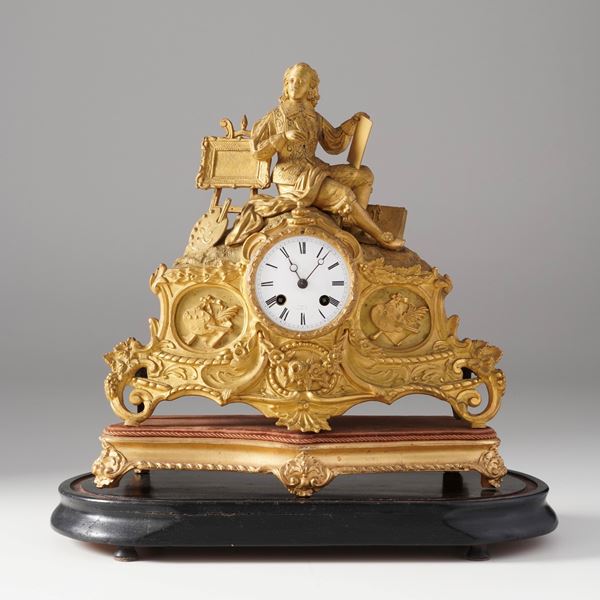 Orologio in metallo dorato. XIX secolo