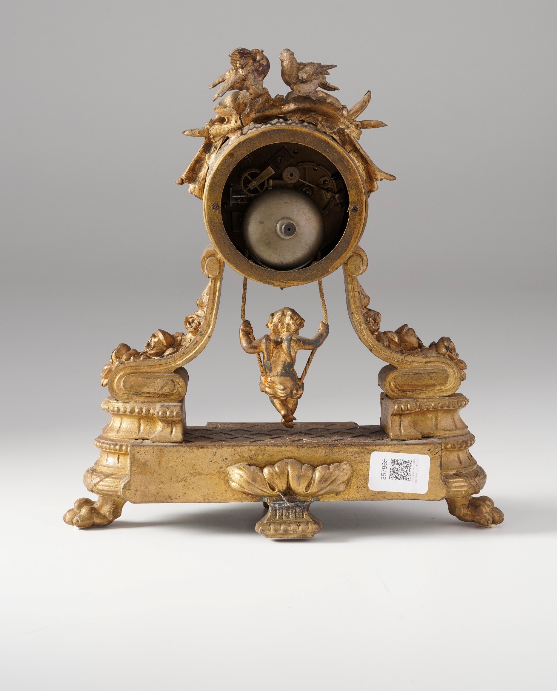 Pendola da tavolo in metallo dorato. Francia XIX secolo
