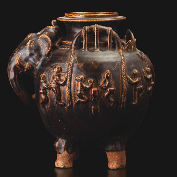 Brown-glazed terracotta vase with relief decoration of an elephant head and figures, Khmer, 12th century.