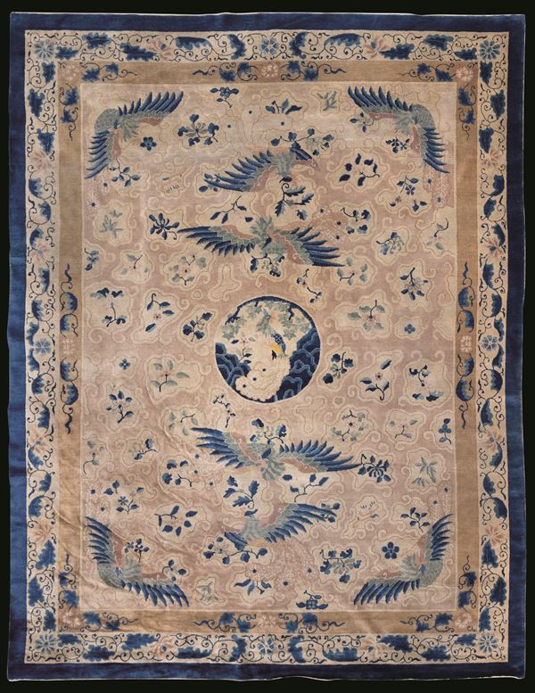 Rare Beijing carpet depicting phoenixes with floral decoration, China, early 20th century.