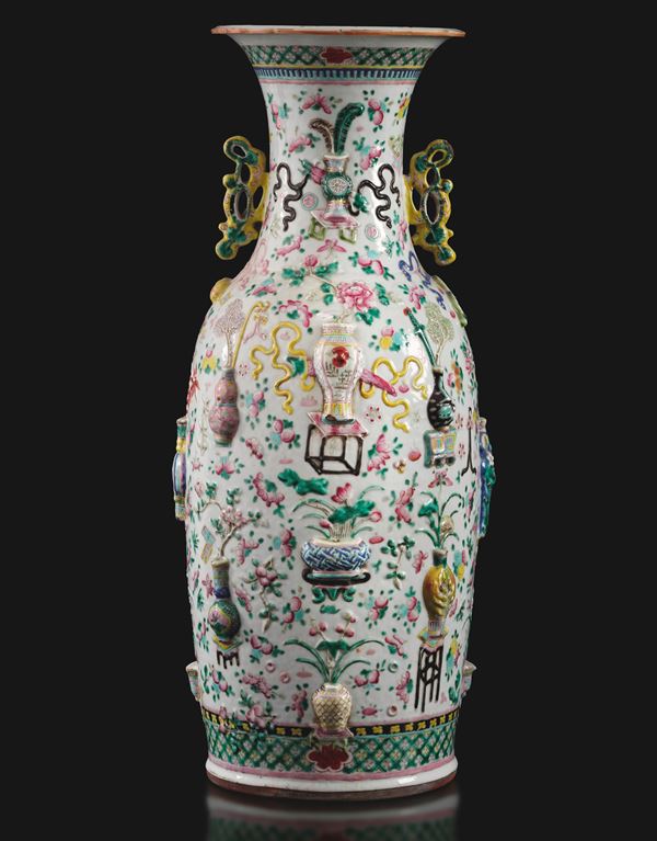 Famille rose porcelain vase with two handles, decorated with floral motifs and Taoist relief elements, China, Qing Dynasty, 19th century.