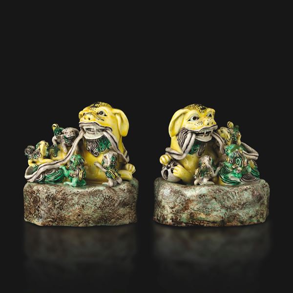 Pair of porcelain Pho dogs in famille verte enamels, China, Qing Dynasty, 19th century.