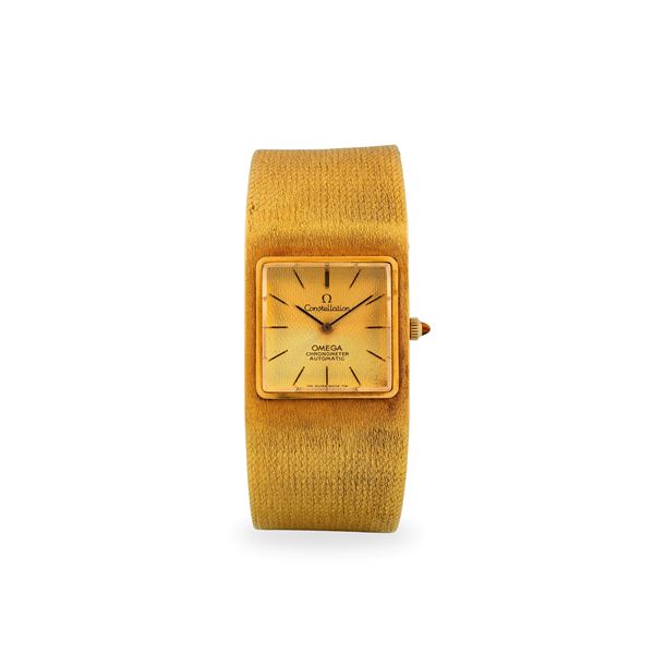 Constellation in oro giallo 18k con bracciale integrato, quadrante dorè lavorato, con scatola originale, circa 1964