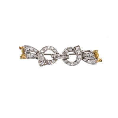 Spilla “Fiocco” con piccoli diamanti, montatura in oro bianco e oro giallo 750/1000
