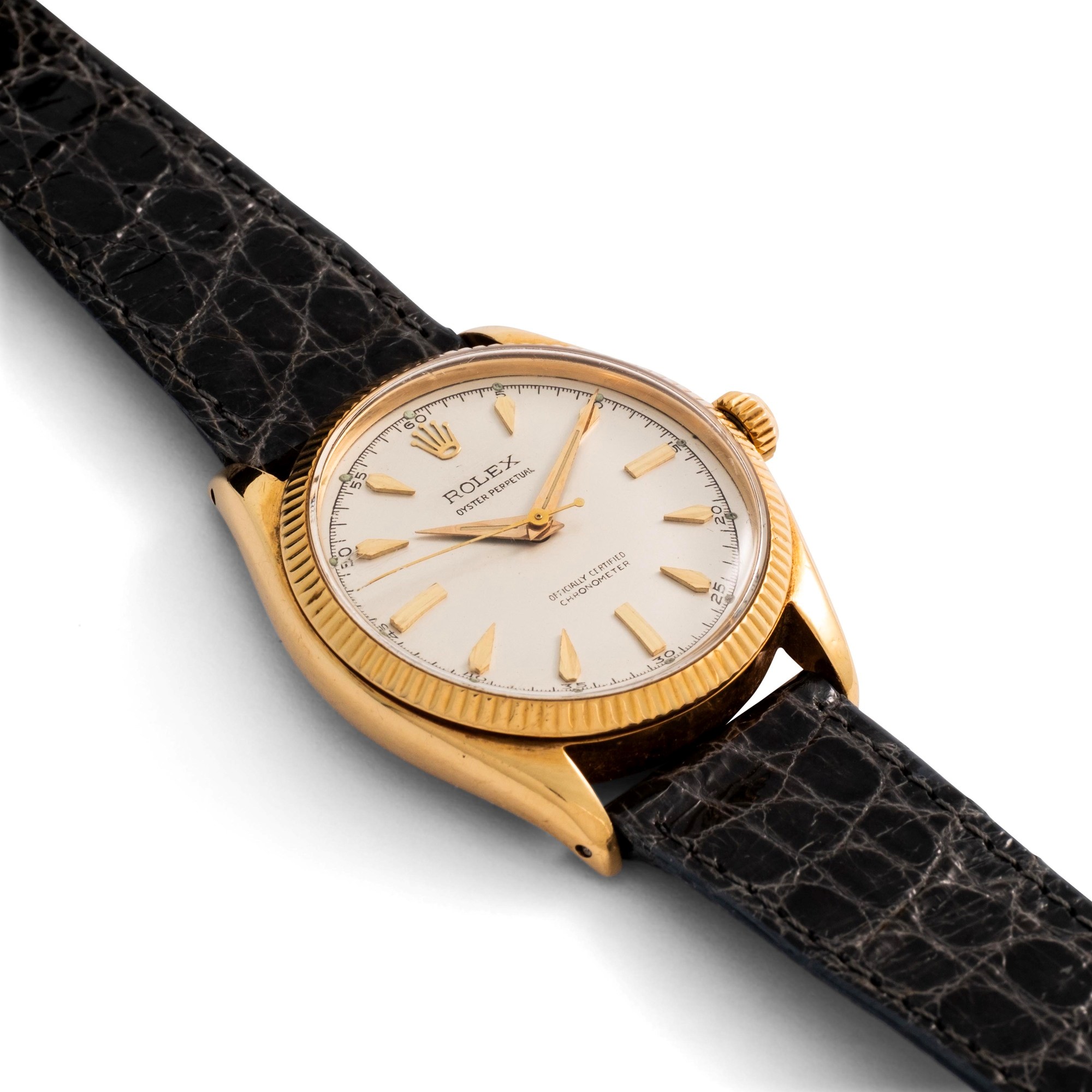 Rolex - Oyster Perpetual ref. 6567 in oro giallo 18k, quadrante argentè con indici a deltoide, ca...