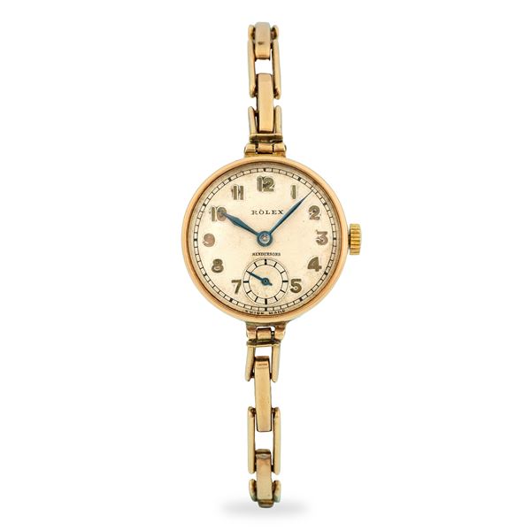 Rolex - Solo tempo in oro rosa 9k, quadrante argentè firmato "Hendersons" con numeri applicati e piccoli secondi al sei, circa 1930