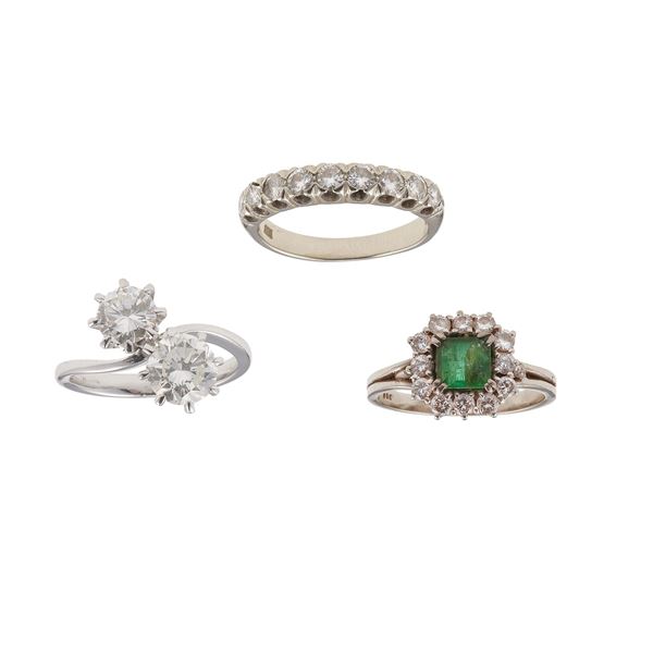 Three diamond, emerald and gold rings