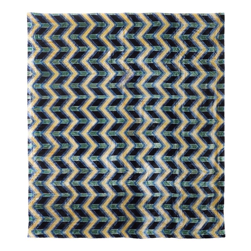 Tessuto in velluto blu, decorazione a zigzag in giallo e azzurro