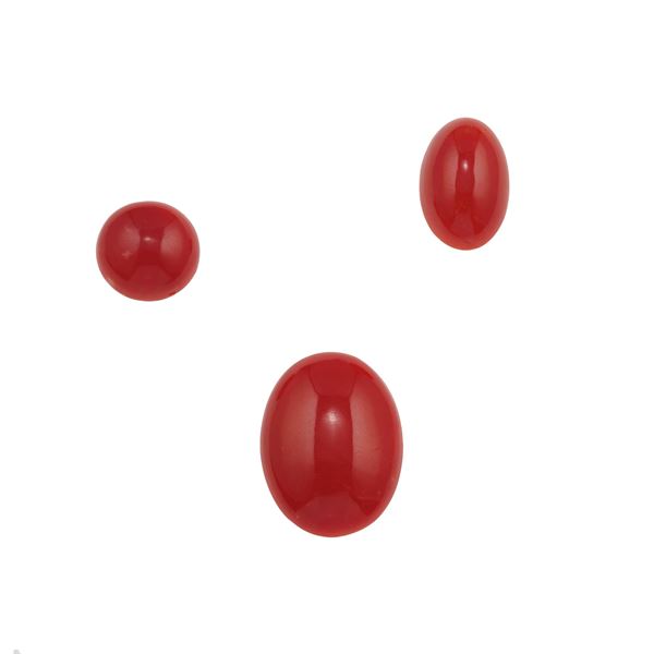 Three cabochon coral plaques