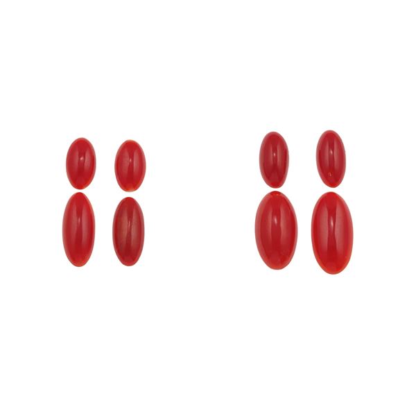 Eight cabochon coral plaques