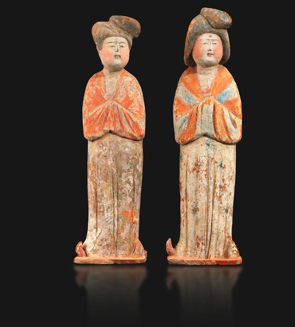 Lot comprising two terracotta figures of female attendants with traces of polychrome decoration, China, Tang Dynasty (618–906).