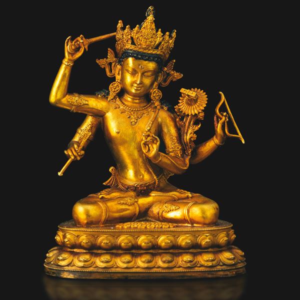 Figura di Manjushri seduta in doppio fiore di loto in bronzo dorato con tracce di monocromia, Tibet, XX secolo