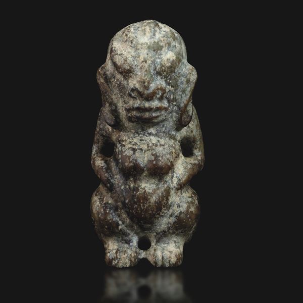Rare and important archaic celadon jade idol, China, Neolithic period.