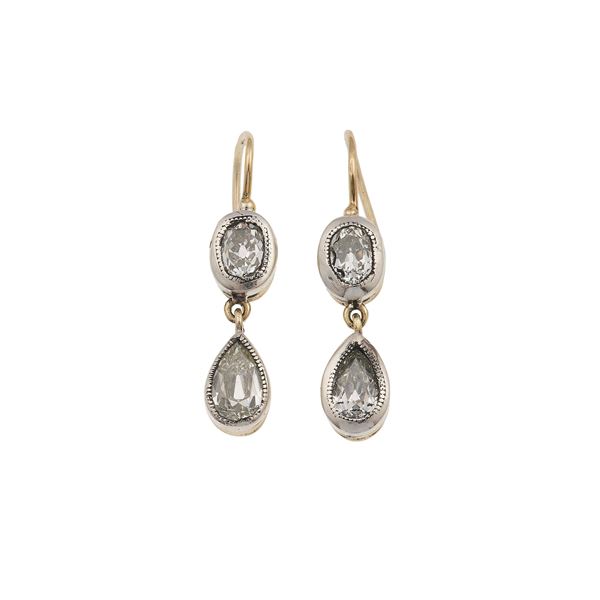 Pair of diamond, gold and silver earrings