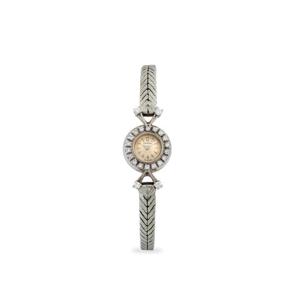 Elegante Cocktail Watch in oro bianco 18k con ghiera e anse impreziosite da diamanti, quadrante argentè con indici applicati, circa 1947