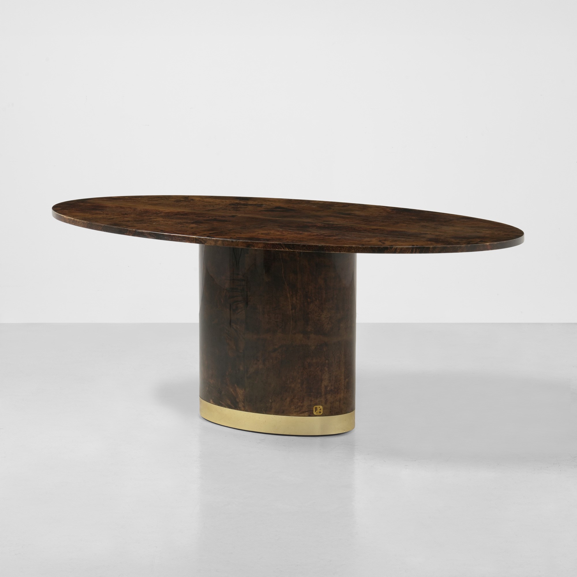 Aldo Tura - Tavolo in legno rivestito in pergamena colorata con fascia in ottone