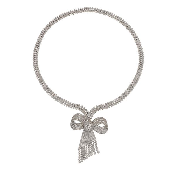 Diamond and gold pendent necklace. The pendent is convertible into a brooch