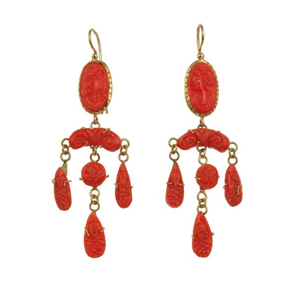 Pair of coral cameos and gold earrings
