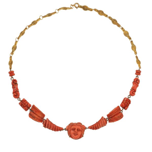Carved coral and gold pendent necklace. The pendent can be removed