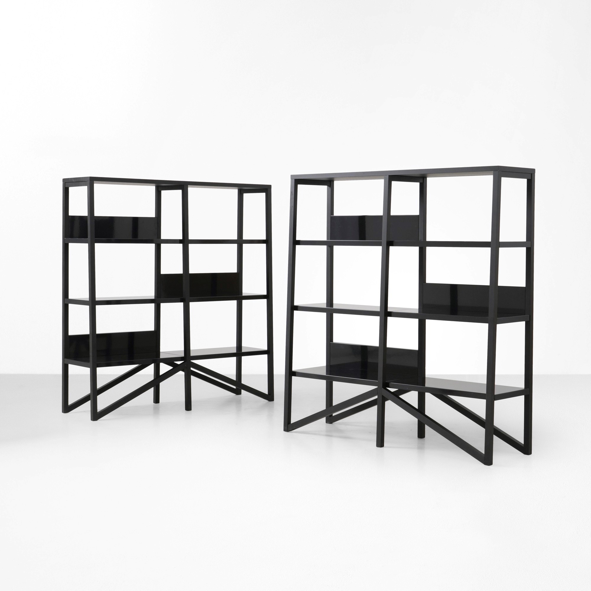 Due librerie, struttura in legno ebanizzato con mensole in metallo laccato (produzione ca. 2010)