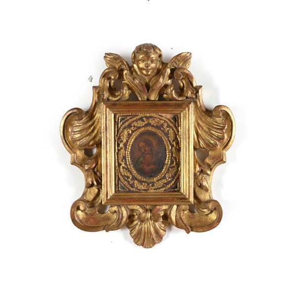 Piccola cornice in legno intagliato e dorato con cherubino, contenente miniatura su rame raffigurante Vergine