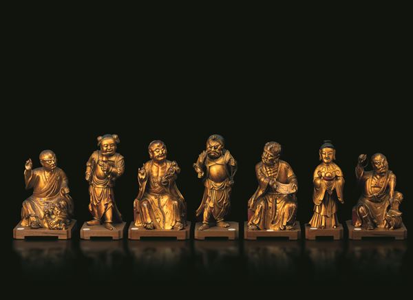 Lot comprising seven wooden figures depicting the Immortals, China, Qing Dynasty, 19th century.