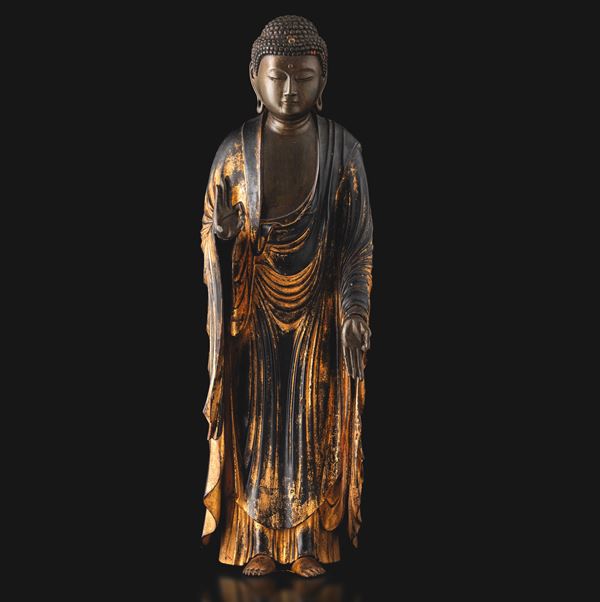 Standing wooden figure of Buddha with traces of gilding, Japan, Edo period, 17th century.