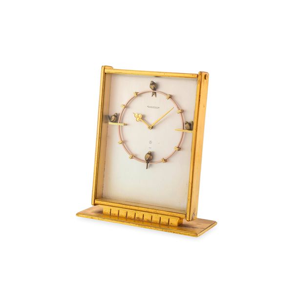 Pendulette 8 Jours in ottone dorato, quadrante argentè con decori con uccellini a ore dodici, tre, sei e nove, carica manuale con riserva 8 giorni, circa 1960