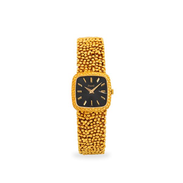 Particolare Solo tempo ref. 9902 in oro giallo 18k con bracciale integrato 