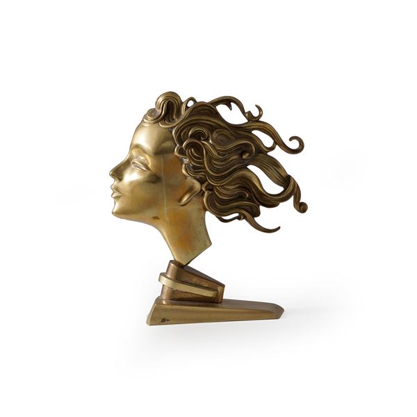 Profilo femminile in bronzo dorato