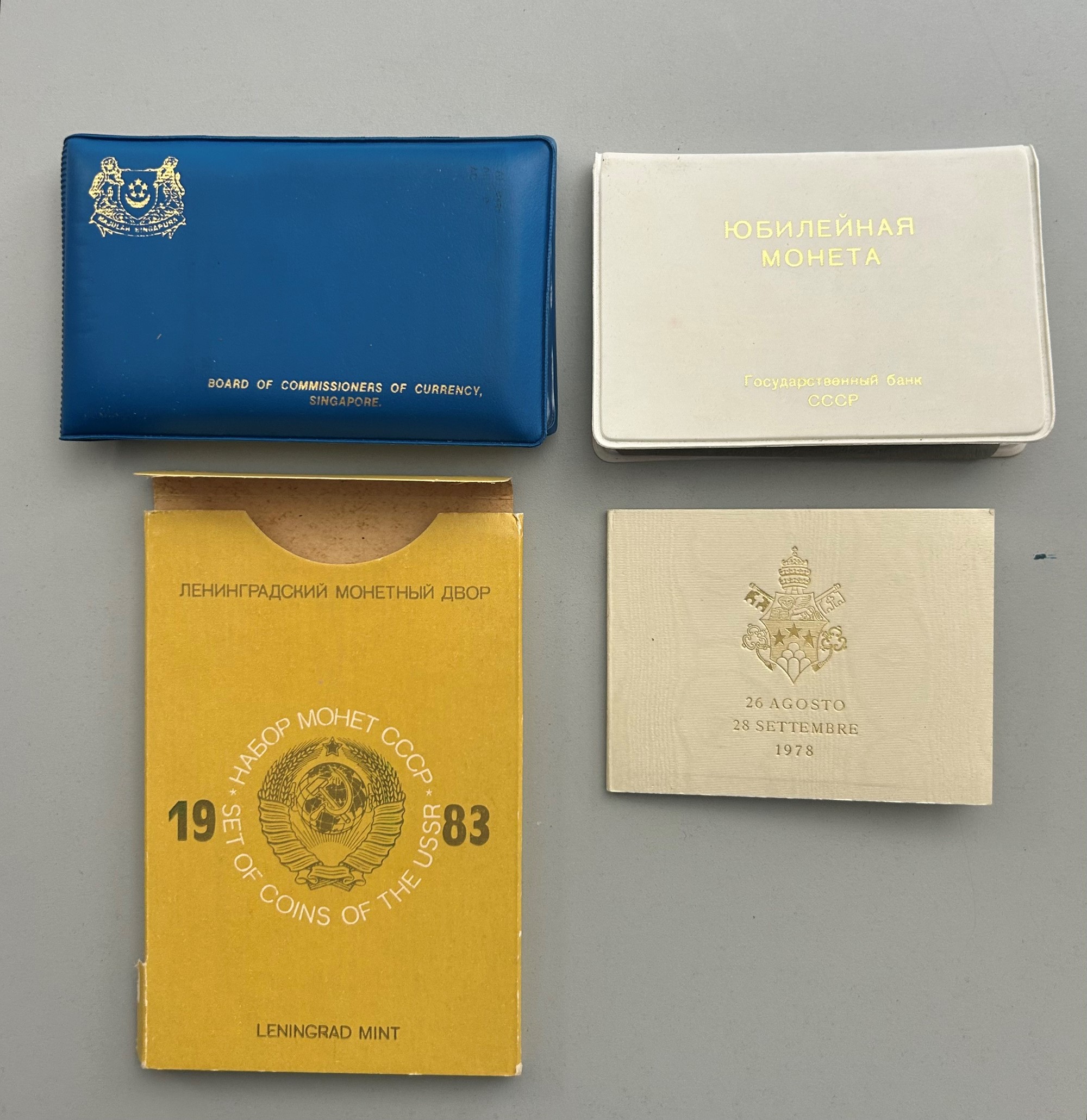 Monetazione estera, serie filatelico-numismatiche in confezione (Unione Sovietica, Singapore, Ung...