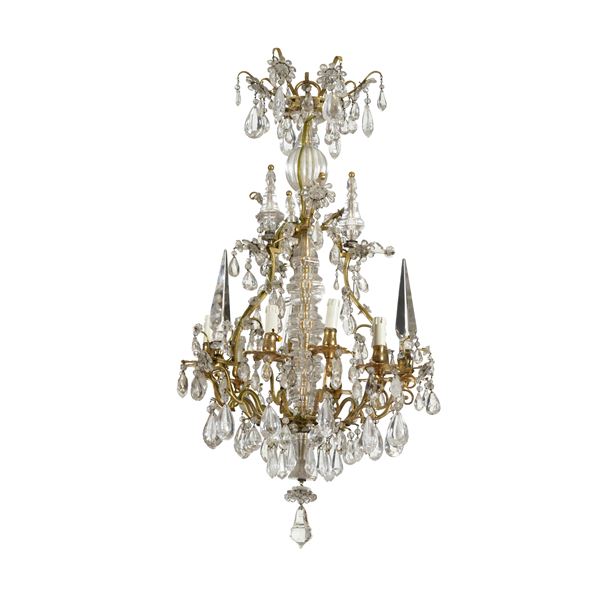 Lampadario in metallo dorato e cristalli di Rocca.
