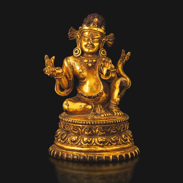 Gilt bronze figure of Jambha on a double lotus base with traces of monochrome pigment, Tibet, 19th–20th century.