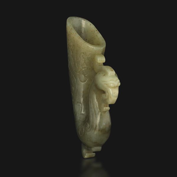 Celadon jade rhyton with incised decoration depicting a phoenix, China, Qing Dynasty, Qianlong period (1736–1796).