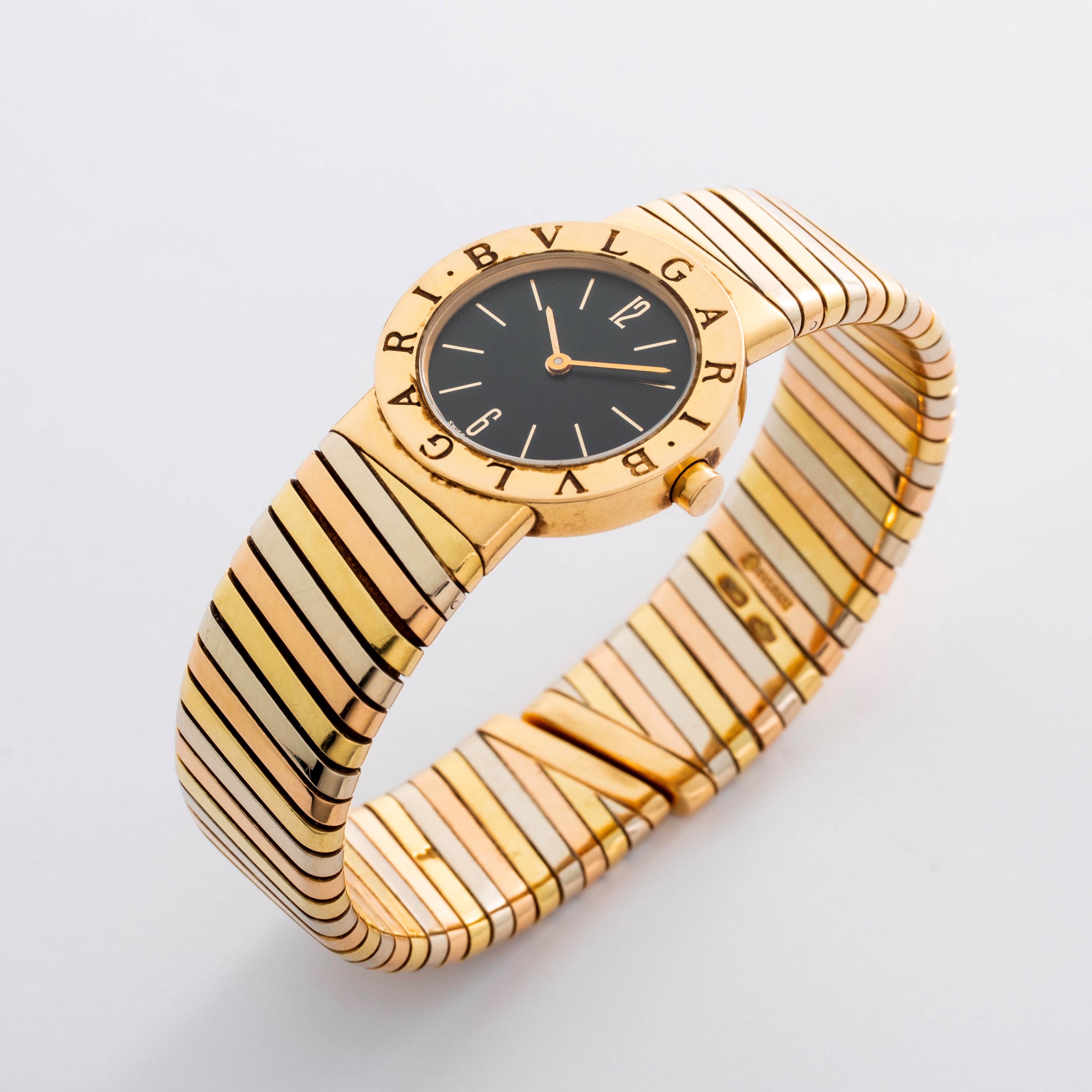 Bulgari - Tubogas in oro 18k giallo, rosa e bianco con quadrante nero, circa 1990