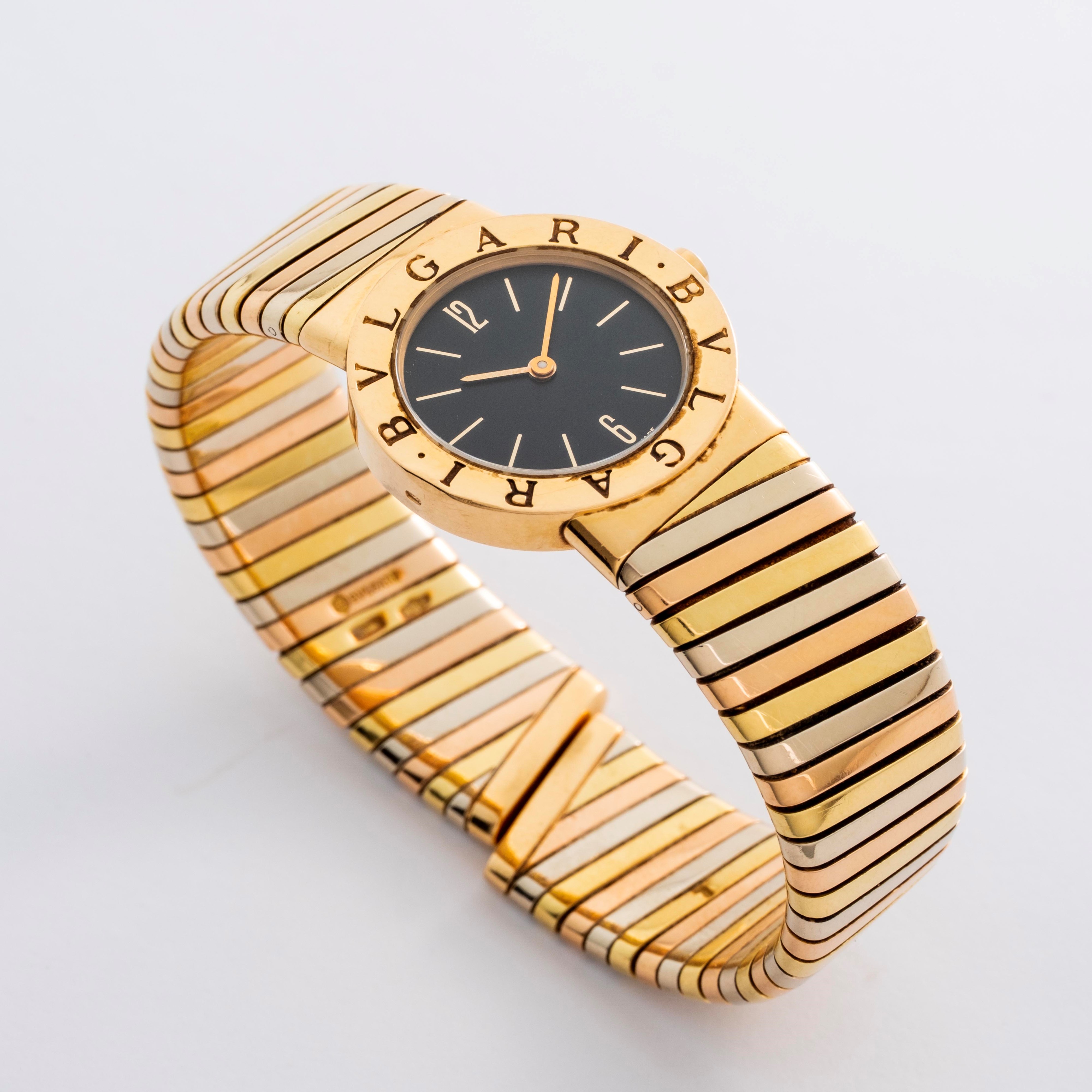 Bulgari - Tubogas in oro 18k giallo, rosa e bianco con quadrante nero, circa 1990