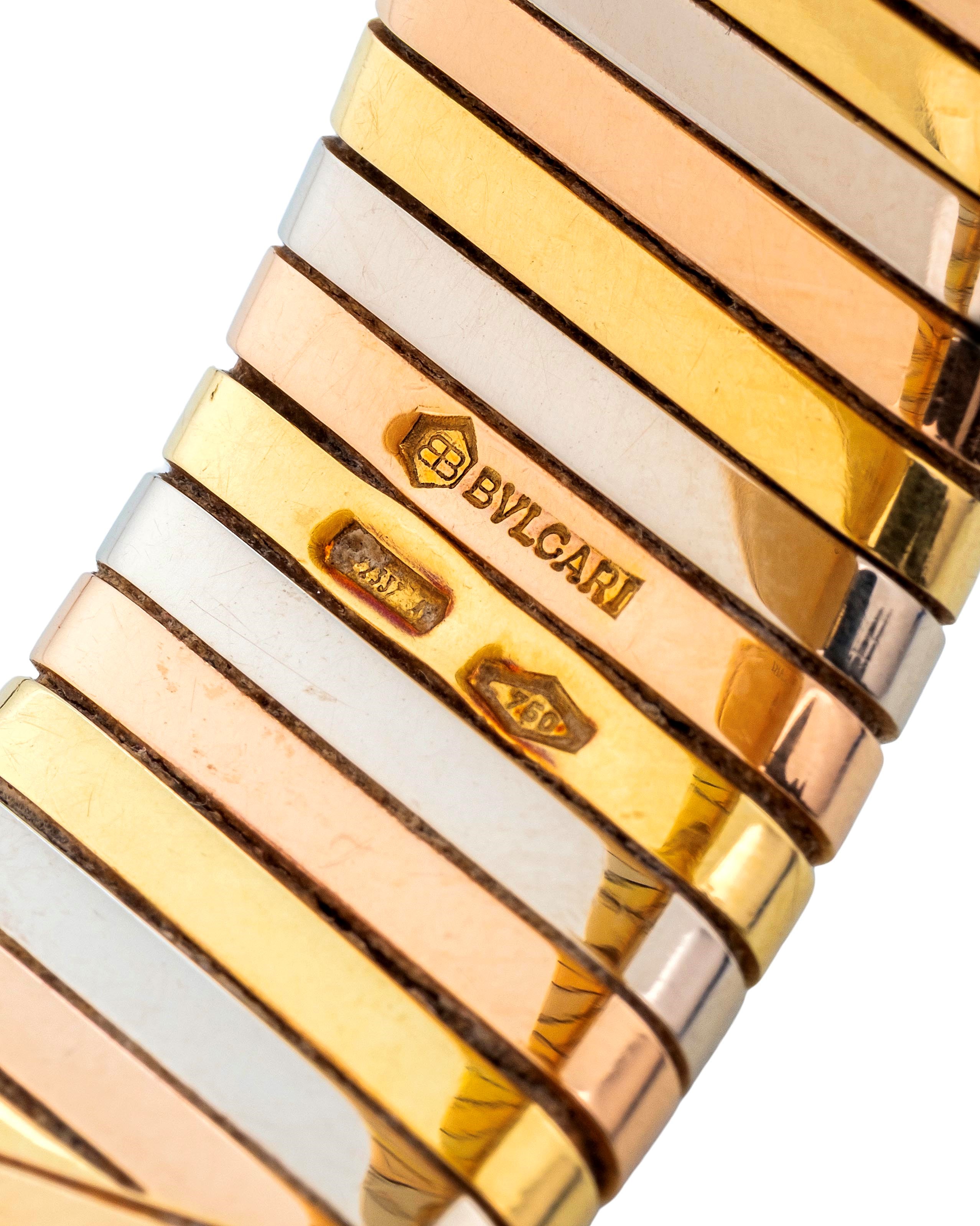 Bulgari - Tubogas in oro 18k giallo, rosa e bianco con quadrante nero, circa 1990