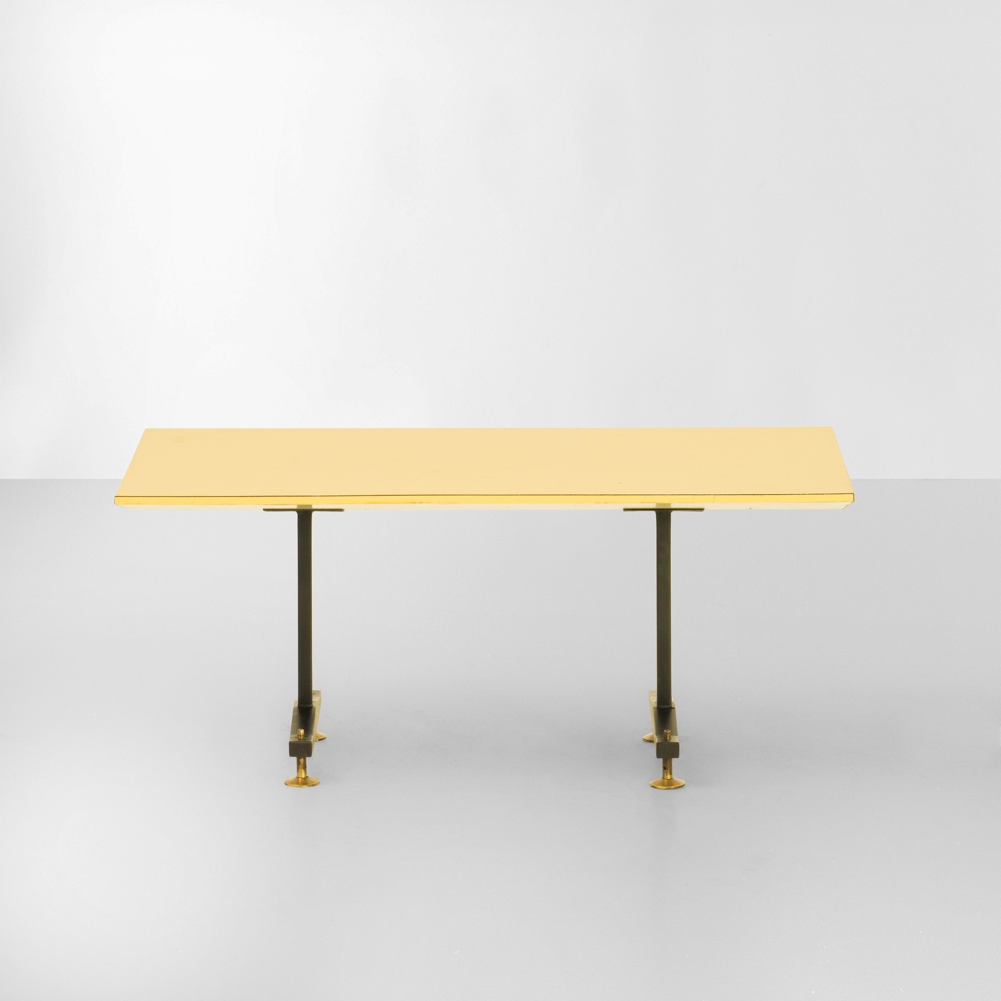 Italia, Tavolo basso, struttura in metallo laccato e piano in laminato (puntali in ottone), ca. 1...