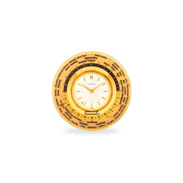 Orologio da tasca in ottone dorato con indicazione delle ore del mondo su ghiera girevole esterna, circa 1960
