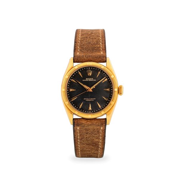 Oyster Perpetual Ovetto ref. 6085 in oro giallo 18k, quadrante nero “Chevron” con indici a daga e lancette Dauphine, circa 1961