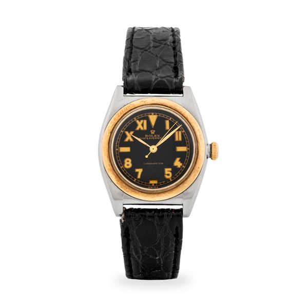 Rolex - Oyster Perpetual Ovetto ref. 3133 in acciaio e oro giallo 18k, quadrante nero "California", circa 1945