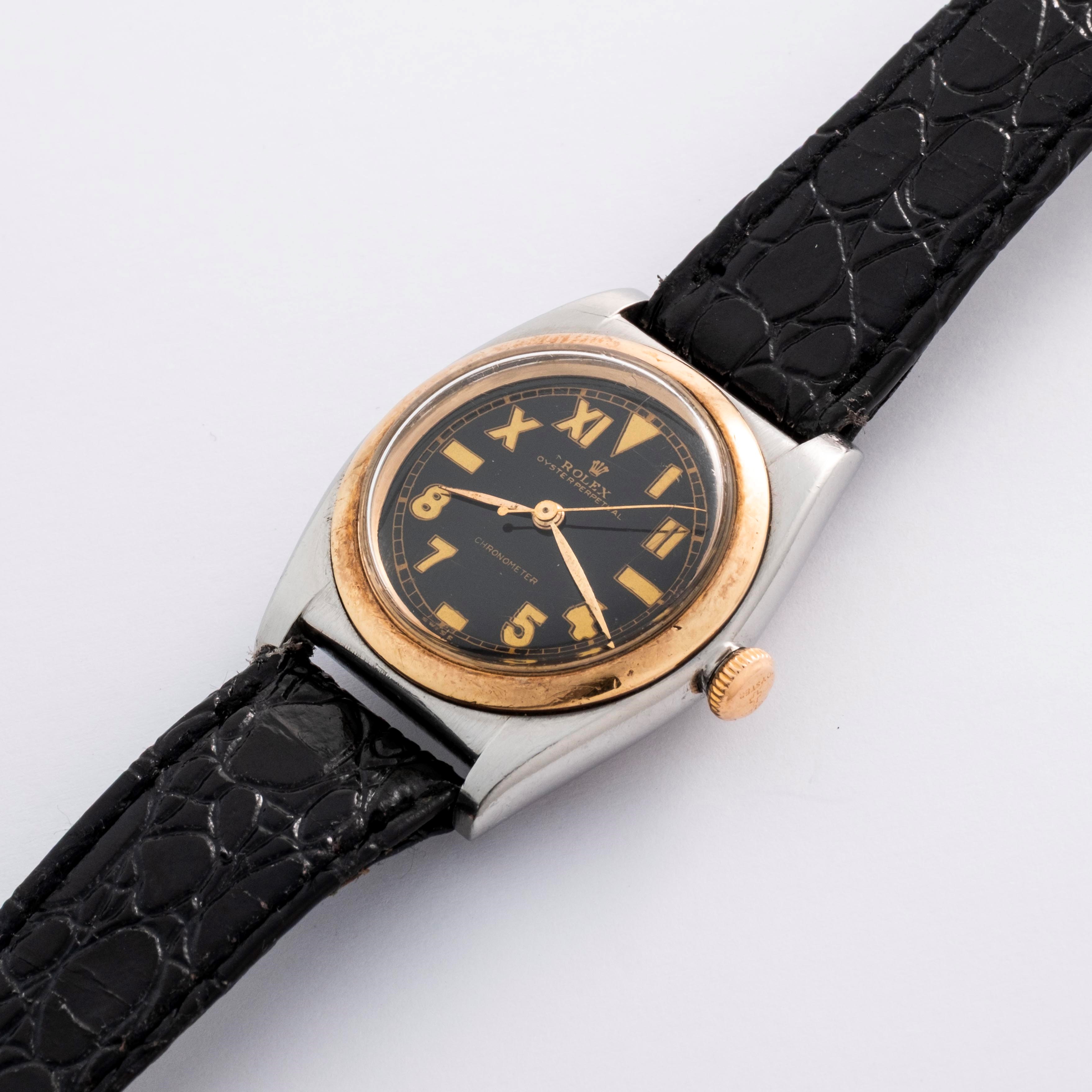 Rolex - Oyster Perpetual Ovetto ref. 3133, acciaio e oro giallo 18k, quadrante nero “California”,...