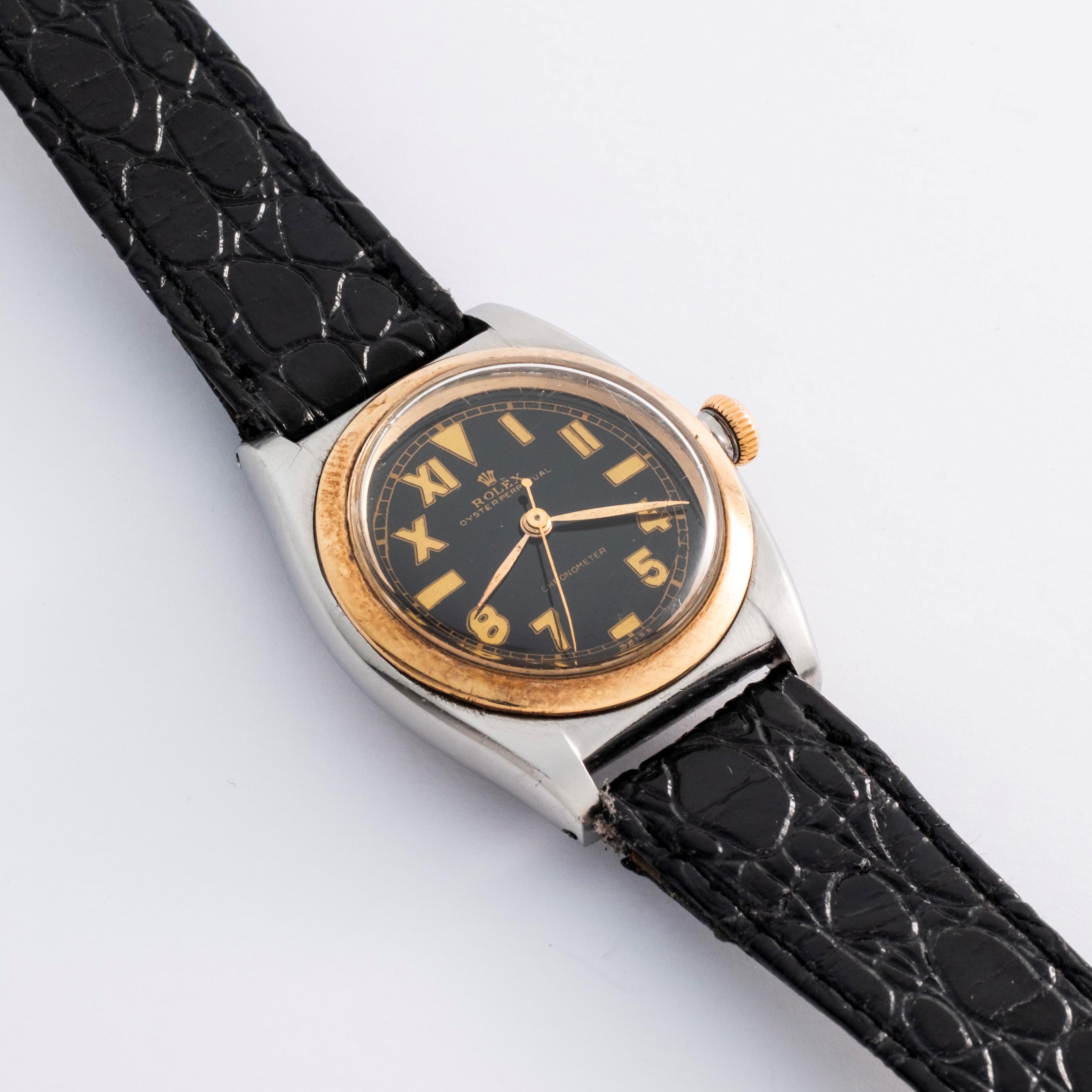 Rolex - Oyster Perpetual Ovetto ref. 3133, acciaio e oro giallo 18k, quadrante nero “California”,...
