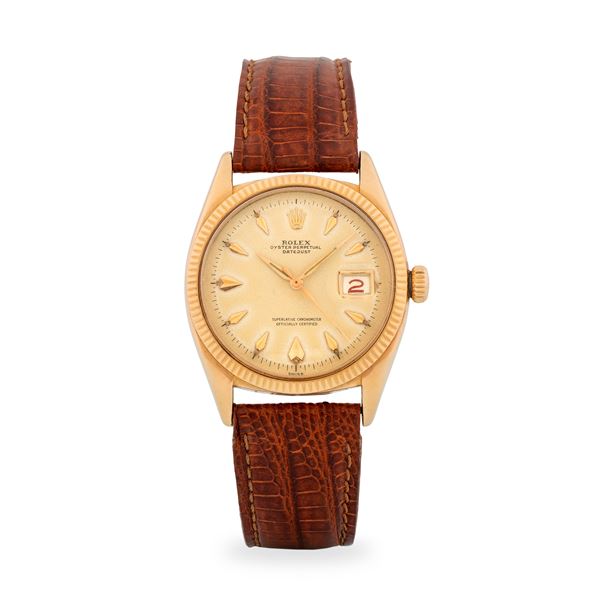 Rolex - Datejust ref. 6605 in oro giallo 18k, quadrante champagne con indici a deltoide e lancette Alpha, circa 1956
