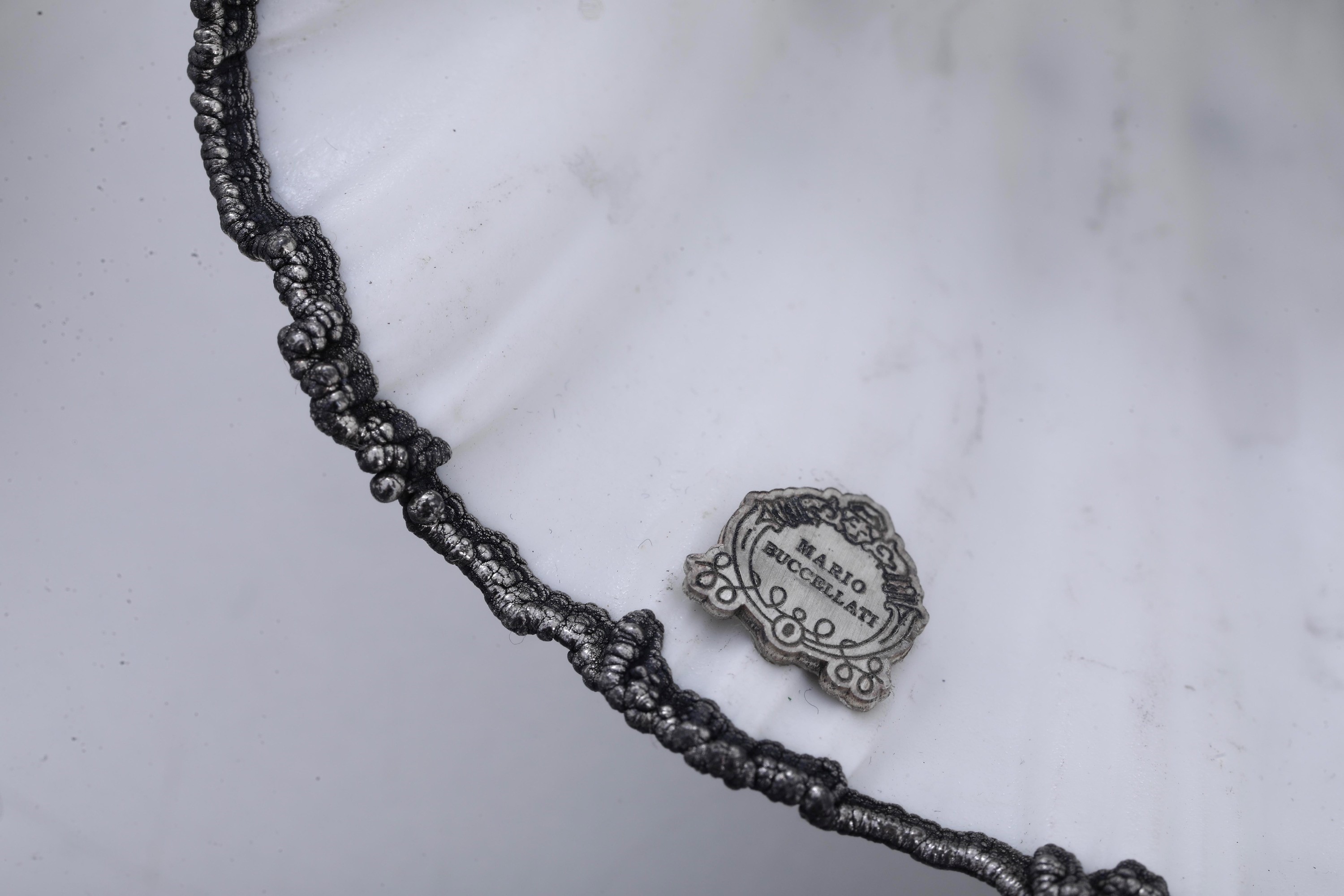 Mario Buccellati (etichetta a scudo), Lotto di tre conchiglie rivestite in argento