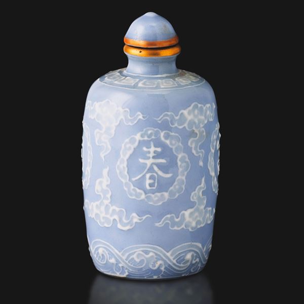 Claire-de-lune porcelain snuff bottle with relief decoration and inscriptions, China, Qing Dynasty, Qianlong period (1736–1796).
